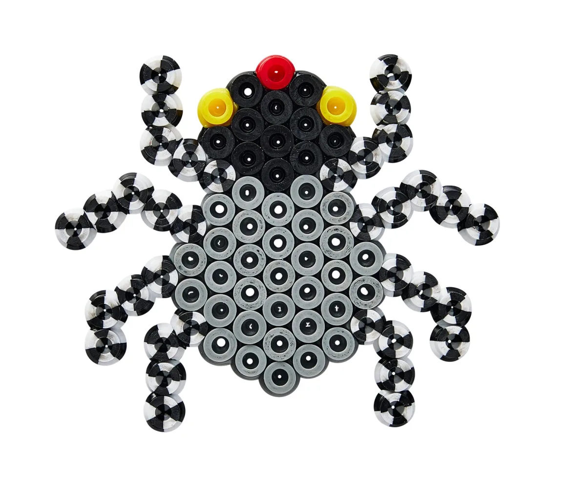 A real Hama Halloween spider uses a black and gray body, striped legs, red and yellow eyes, and a compact connected silhouette