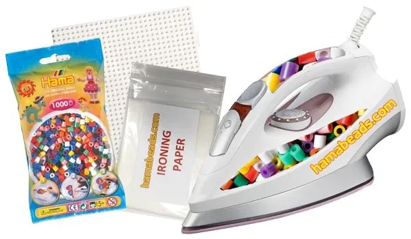 Real Hama beads, pegboard, ironing paper, and household iron prepared for fusing